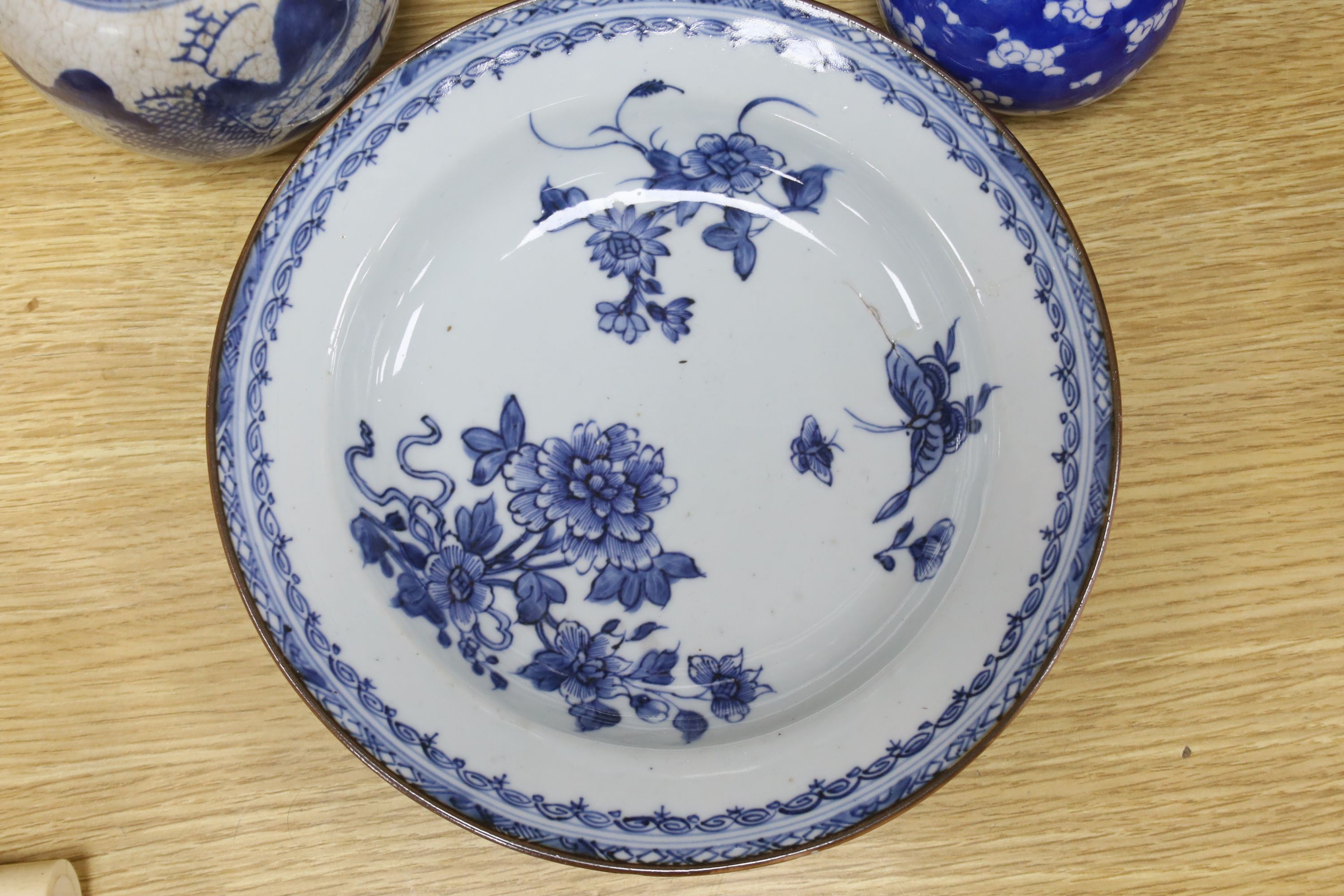 A Chinese blue and white dish, a bottle vase and jar, together with a famille rose jar lacking cover, height 29cm